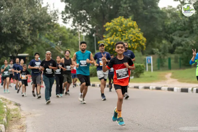 A boy running with a group of adults on the route