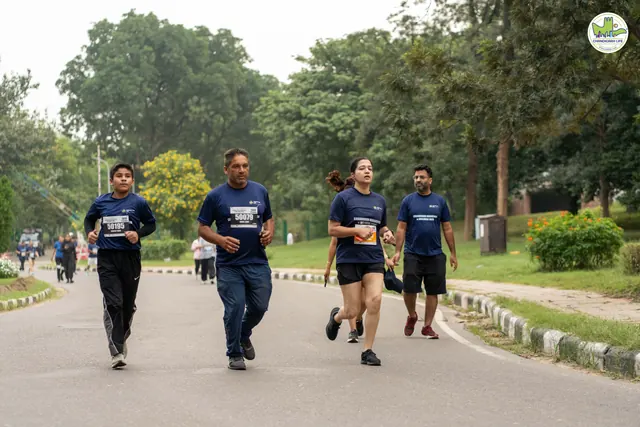 Four men running together on the route