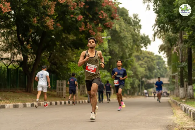 Runners under flowering trees on the route