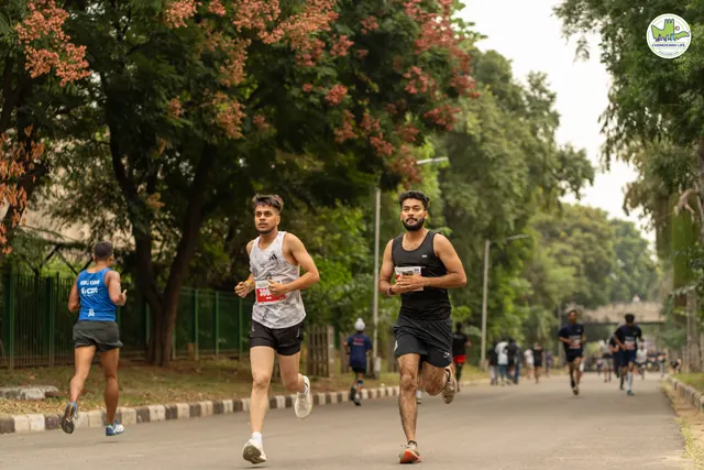 Three runners under flowering trees