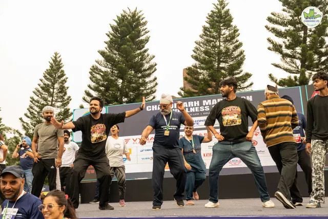 Participants jumping together on the stage