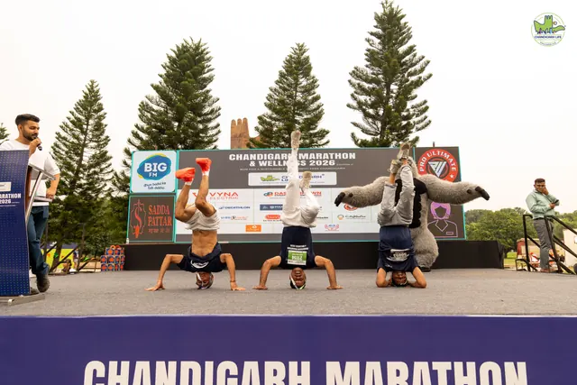 Participants doing headstands on the stage