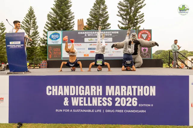 Participants in yoga poses on the stage