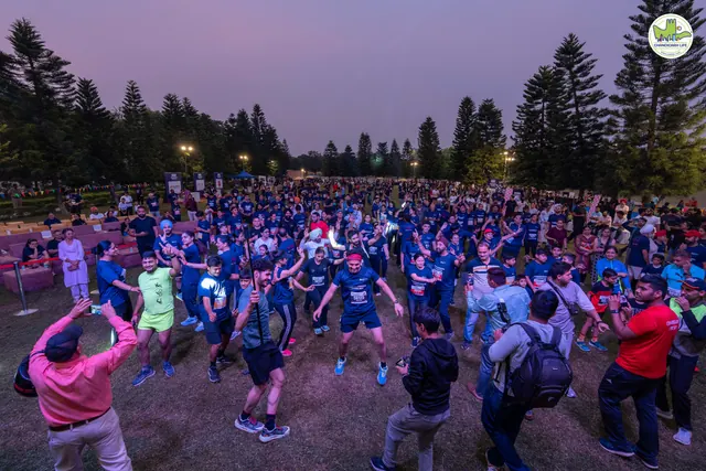 Participants warming up in front of the stage