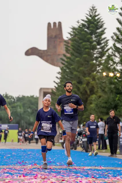 A boy and a man finishing together