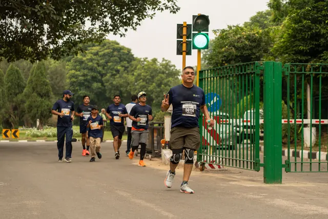 A runner at a green traffic signal on the route