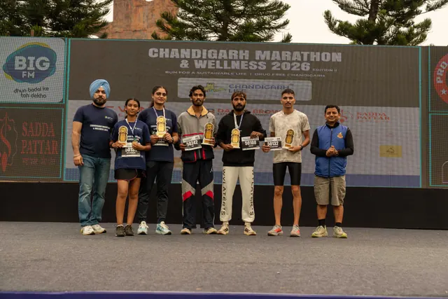 Winners lined up with trophies on the stage