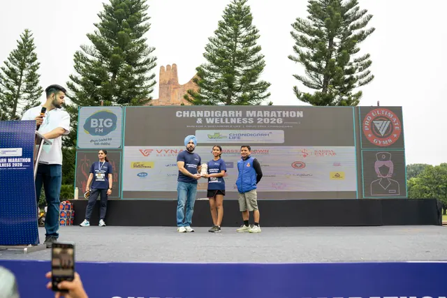 The stage with the event backdrop, seen from the crowd