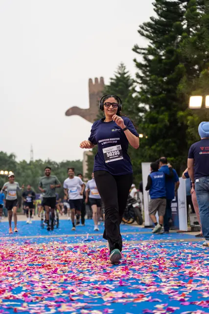 A woman finishing on the petal-covered carpet