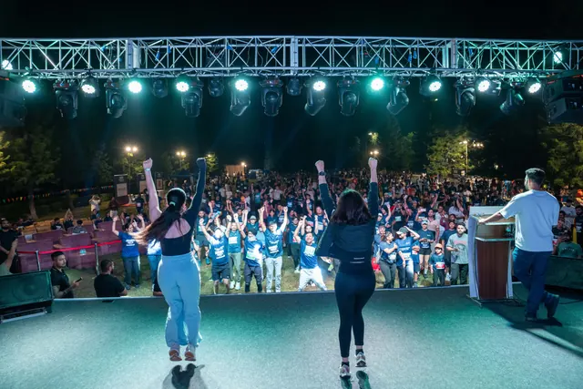 Instructors leading the crowd from the stage