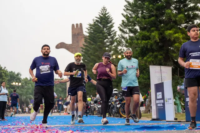 A group of runners finishing together